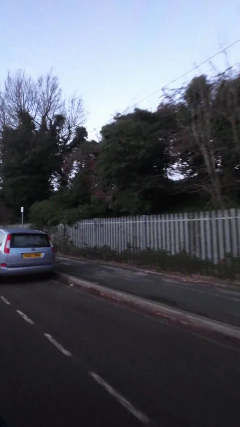 Urban Drive Through City Streets of England During Sunset Stock Footage 326202553