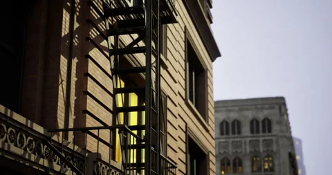 Urban evening view featuring fire escape on building in city center Stock Footage 306204748