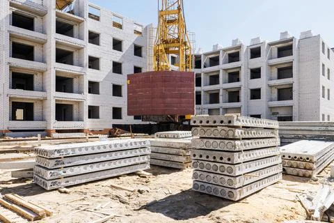 Urban Evolution: A dynamic construction site bustling with towering structu.. 写真素材