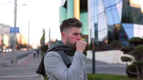 Urban Flu Agony Capturing a Bearded Man Illness in the Outdoors Stock Footage 323936204