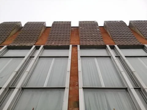Urban Geometry, underside view to red steel old building. A fragment of the e Stock Photos
