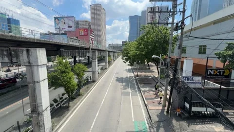 Urban Highway and Elevated MRT-3 Train Tracks in Mandaluyong City 4K 60fps Stock Footage 338278164
