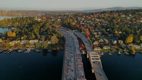 Urban Interface: Aerial View of Highway Bordering Autumn-Colored Suburb	 Stock Footage 281809474