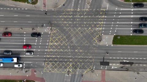 Urban Intersection Aerial Shot with Traffic and Yellow Markings Stock Footage 321855916