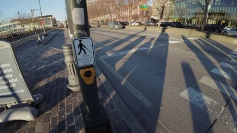 An Urban Intersection bustling with Traffic and Multiple Street Signs All Around Vidéo 291510700