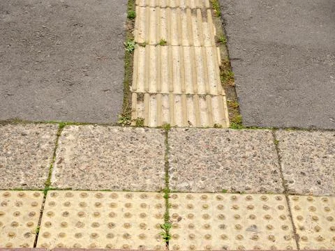 Urban intersection transition, featuring various paving textures Stock Photos