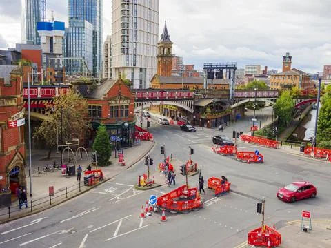 Urban intersection under construction Deansgate Manchester with red barrier.. Stock Photos