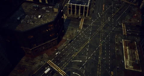 Urban intersection viewed from above during nighttime in a busy city Stock Footage 306200125
