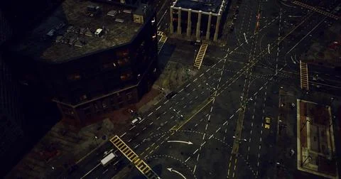 Urban intersection viewed from above during nighttime in a busy city Stock Illustration