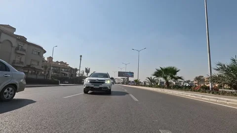 Urban Journey Through Wide Streets New Cairo Showing Buildings Traffic Life Video stock 329816632