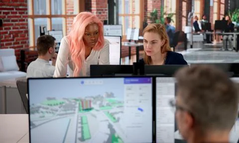 Urban Land Mapping Engineer Studies 3D City Data Using GIS Software. Stock Photos