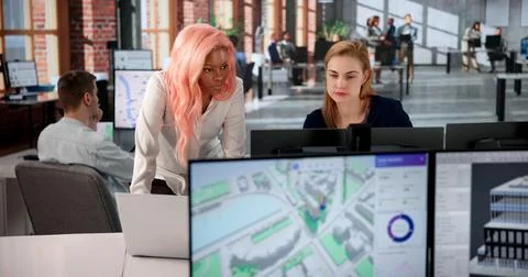 Urban Land Mapping Engineer Studies 3D City Models Using Computer Software. 写真素材