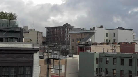 Urban Landscape featuring classic Brick Architecture, Birds fly thru frame, HD Stock Footage 86884140