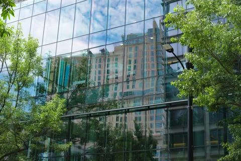 Urban landscape reflected in tower windows in Charlotte, NC Stock Photos