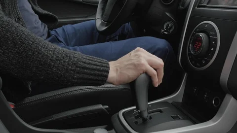 Urban man using transmission and using steering wheel. Man hand on automatic Stock-Footage 108624151