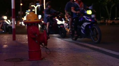 Urban night traffic with fire hydrant on the sidewalk Stock Footage 336099406