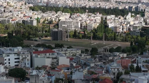 Urban panorama of Athens featuring ancient Temple of Olympian Zeus under restora Stock Footage 337311694