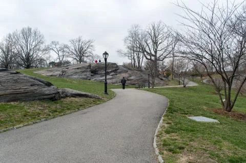 Urban park in early spring, middle of march, bare trees. New York Stock Photos