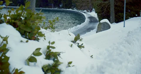 Urban park path covered in snow after blizzard Stock-Footage 129786853