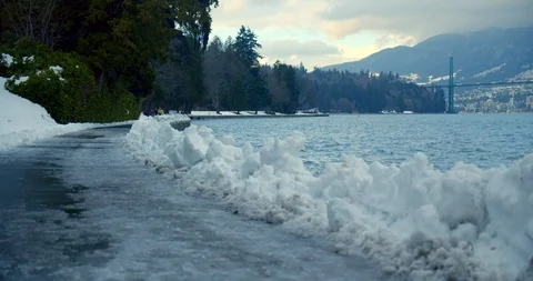Urban park path covered in snow after blizzard Video stock 129787100