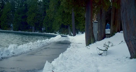 Urban park path covered in snow after blizzard Stock-Footage 129787199