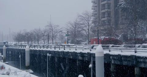 Urban path by ocean during snow storm Stock-Footage 129783902