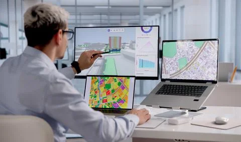 Urban Property Mapping Expert Analyzing Construction Plans Using GIS Software 스톡 사진