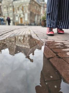 Urban puddle reflection in Haarlem, The Netherlands Stock Photos