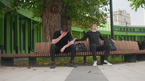 Urban quiet exchange, Tense men share silent moment, Men confront quiet tension Stock Footage 333646033