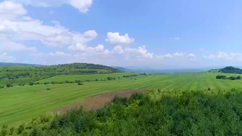 Urban road and green fields Stock Footage 137155853