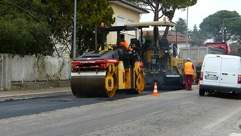 Urban road under construction, asphalting in progress. Stock Footage 73578464