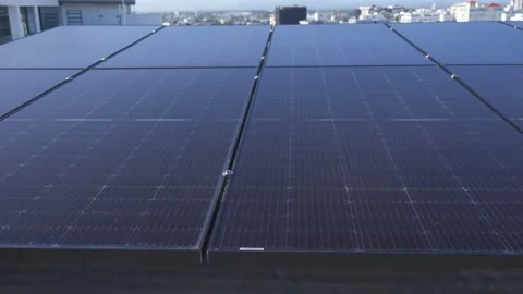 Urban Rooftop Photovoltaic Solar Array Stock-Footage 337137408