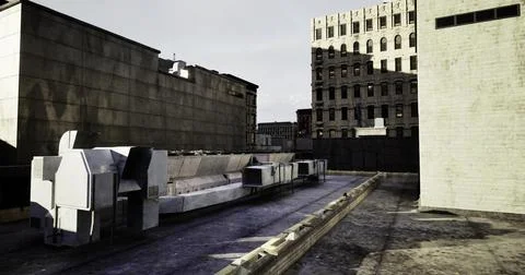 Urban rooftop view with industrial structures and city buildings in daylight Ilustración de archivo
