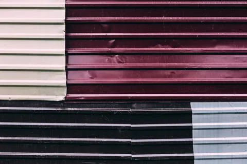 Urban rough background pattern, pieces of metal profile decking fence Stock Photos