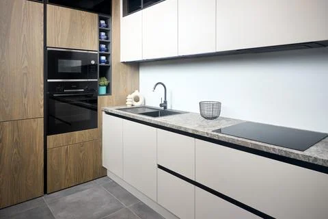 Urban rustic loft style kitchen interior in wooden facade and stoneware Foto stock