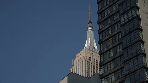 Urban Scene Capturing Juxtaposition Of Ancient Designs And Sleek Contemporary Stock Footage 323770903