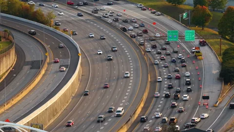 Urban scene with driving traffic on elevated interstate road in Atlanta, Georgia Stock Footage 329141581