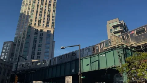 Urban scene elevated train moving through skyscrapers and city life Vidéo 291509949