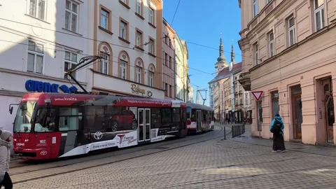 Urban scene people walking while tram is passing in Olomouc Stock Footage 263483913
