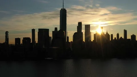 Urban Silhouette of Lower Manhattan, New York City at Sunrise. Aerial View. USA Stock Footage