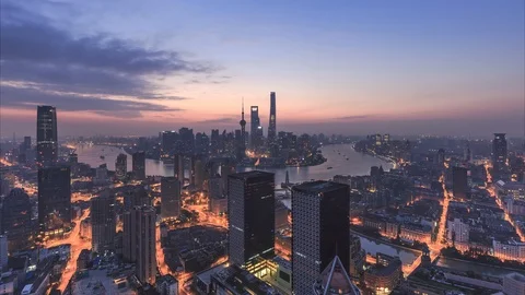 Urban skyline and cityscape at sunrise in Shanghai China. Stock Footage