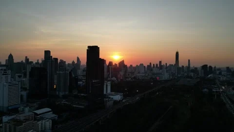 Urban Skyline and Sun Setting Over Bangkok, Thailand Video stock 335256252