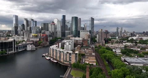 Urban skyscraper against cloudy sky along water channel Stock-Footage 201435038