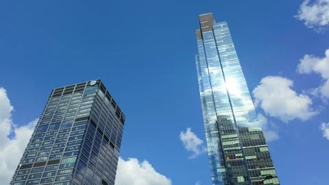 Urban skyscraper timelapse: clouds reflecting on glass buildings Stock Footage 331533243