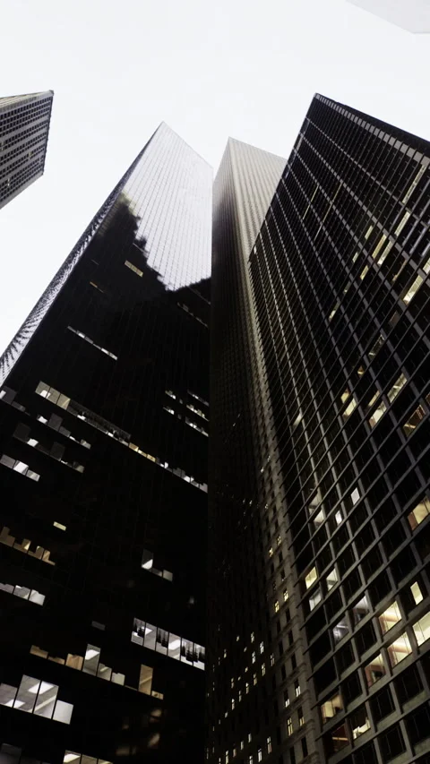 Urban skyscrapers create a dramatic perspective in a bustling city skyline Stock Footage 325076480
