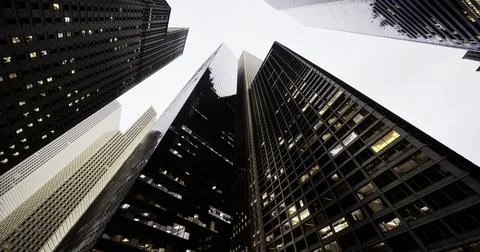 Urban skyscrapers create a dramatic perspective in a bustling city skyline Stock Illustration