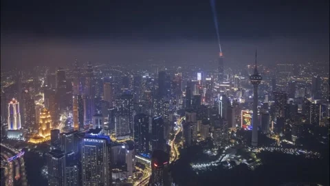 Urban sprawl unfolds beneath a canopy of night lights Stock Footage 318813554