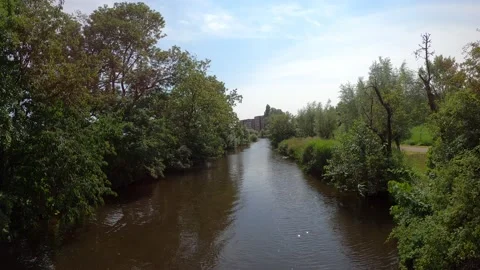 Urban stream with bicycle path Stock Footage 157675536