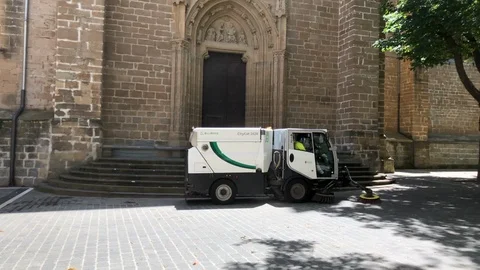 Urban street sweeper truck in a Spanish city. Slow motion. Stock Footage