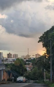 Urban sunset with cloudy sky Stock Photos